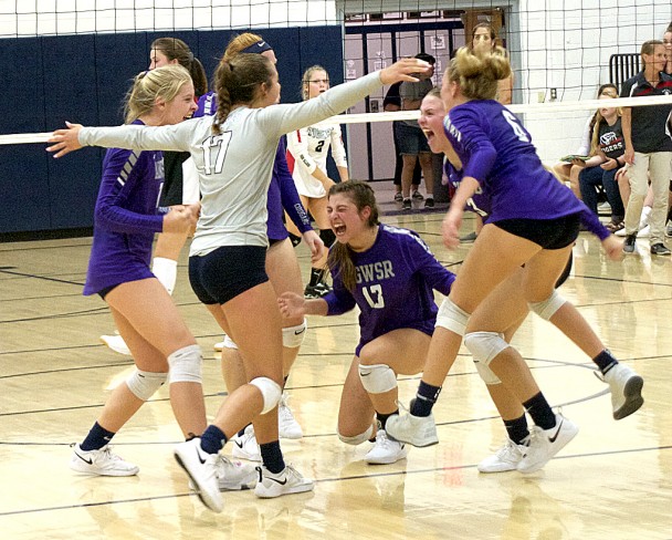 AGWSR volleyball celebrates at mid-court after scoring match point in a come-from-behind five-set victory over South Hardin Tuesday. (Scott Bierle, Mid-America Publishing)