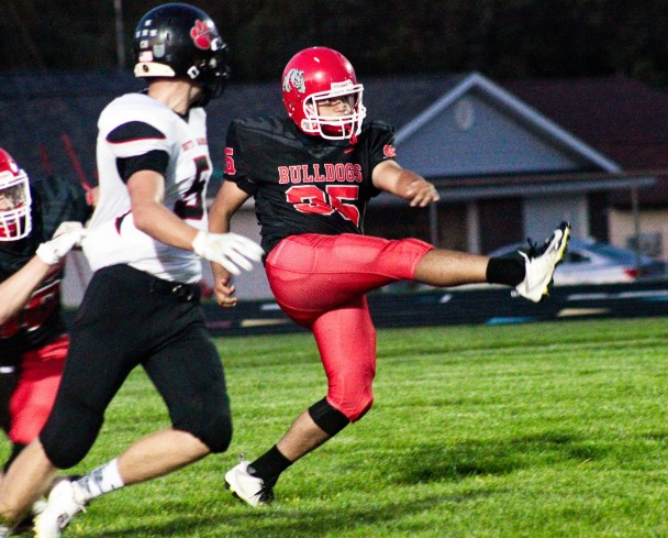 Bulldog punter Francisco Alejo follows through on one of his nine punts against South Hardin last Friday, Sept. 13 at Hampton. The number of punts by Alejo is a school record in the modern era. (Kristi Nixon/Hampton Chronicle)