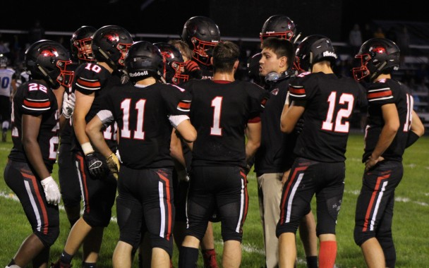 West Fork head coach James Perez discusses strategy with his team during a timeout during Friday’s 35-0 win over Central Springs. The Warhawks play host to Nashua-Plainfield for homecoming this Friday night. (Dick Fridley photo)